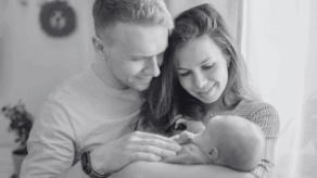 Young couple holding their new baby